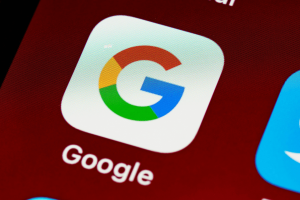 The Google app logo on a smartphone.